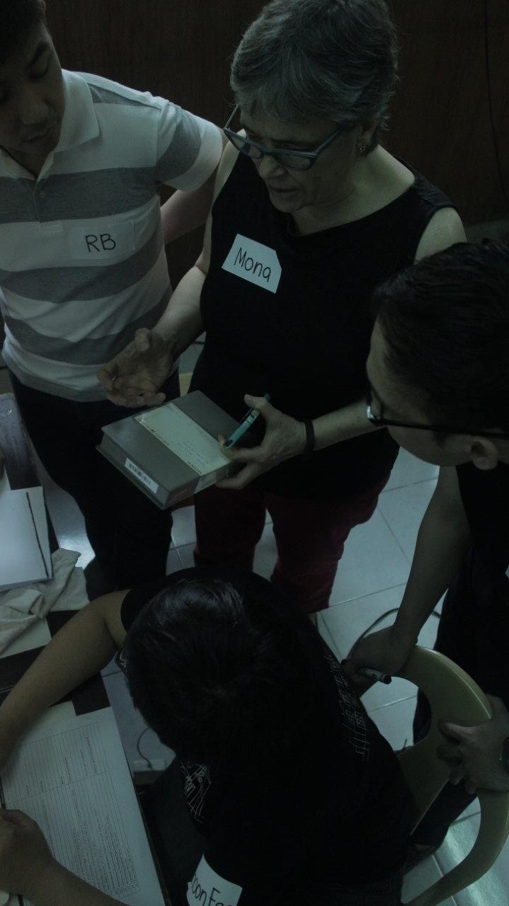 Prof. Mona Jimenez "freeing the tapes" with community archiving workshop participants in Manila. Photo courtesy of UPSLIS.